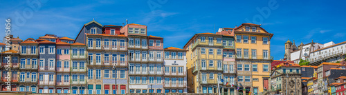 Panoramic view with old multi-colored houses in old town over Douro river. Porto Ribeira, along da Cais da Ribeira, Porto, Portugal photo