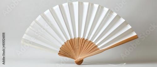 A close shot of a folding traditional white fan mockup for summer kept on a studio white background with space for text or product  Generative AI.