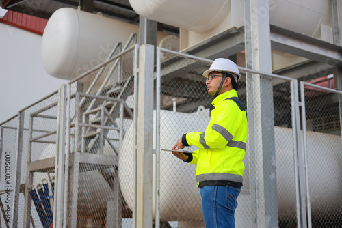 Wallpaper Mural Portrait of professional man engineer working checking work place to keep liquid helium in industry. Torontodigital.ca