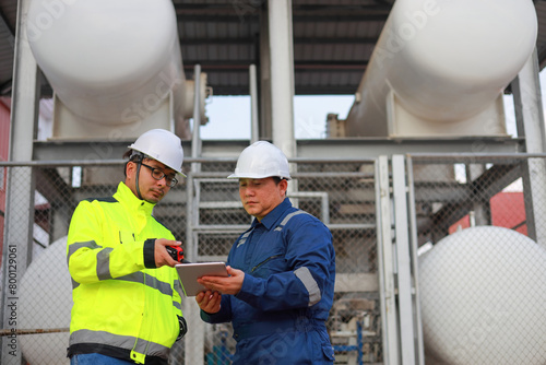 Wallpaper Mural Portrait of professional man engineer working checking work place to keep liquid helium in industry. Torontodigital.ca