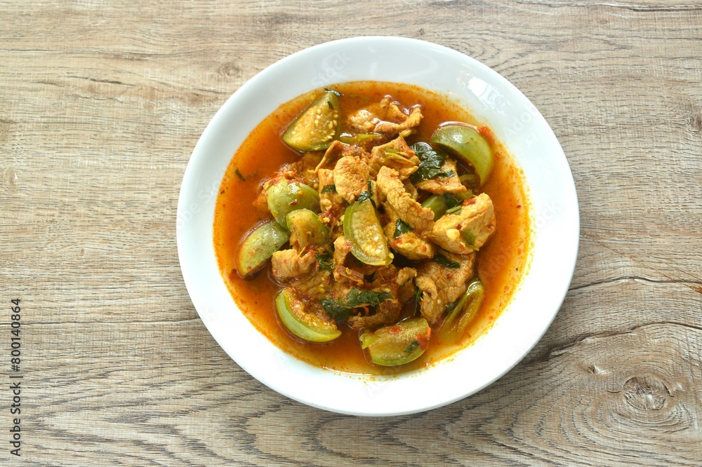 spicy boiled slice pork with eggplant in curry soup on plate spicy boiled slice pork with eggplant in curry soup on plate