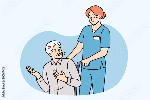 Angry patient in wheelchair swears at nurse, expressing dissatisfaction with healthcare system and high cost of insurance. Woman doctor takes elderly man out of clinic due to lack of health insurance.