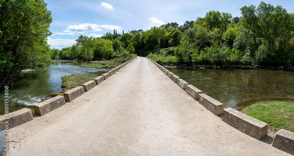 Sommieres, France - 04 15 2024: View of a typical stone bridge in the south of France.