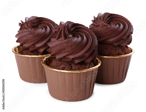 Three delicious chocolate cupcakes isolated on white
