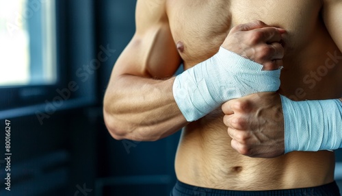 Boxer s trainer wraps hands with tape, symbolizing support in summer olympic games sport