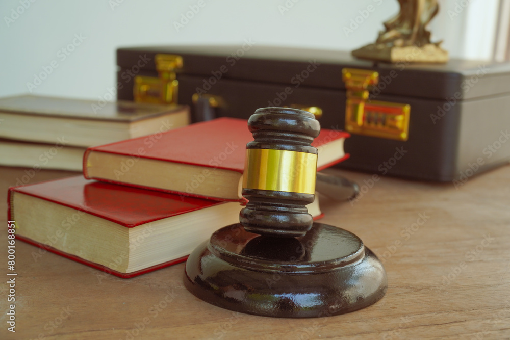 A symbolic image of a wooden gavel, representing law and judgment. With a white background, it evokes the concepts of justice, authority, and legal proceedings A symbolic image of a wooden gavel, representing law and judgment. With a white background, it evokes the concepts of justice, authority, and legal proceedings