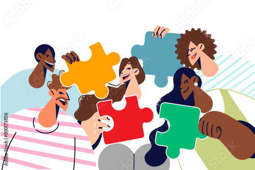 Group multiethnic students proud of tolerance at university, holding puzzle pieces in hands