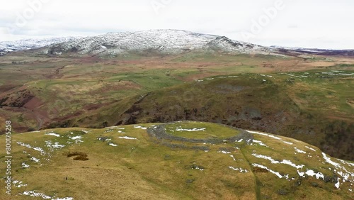 Brough Law prehistoric Iron Age hillfort. N.W. over River Breamish valley near Ingram, Cheviot Hills, Northumberland, England. Video fly in from S.E. photo