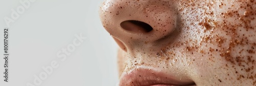 A person undergoes a gentle exfoliation treatment, revealing brighter and smoother skin beneath, close up with copy space photo