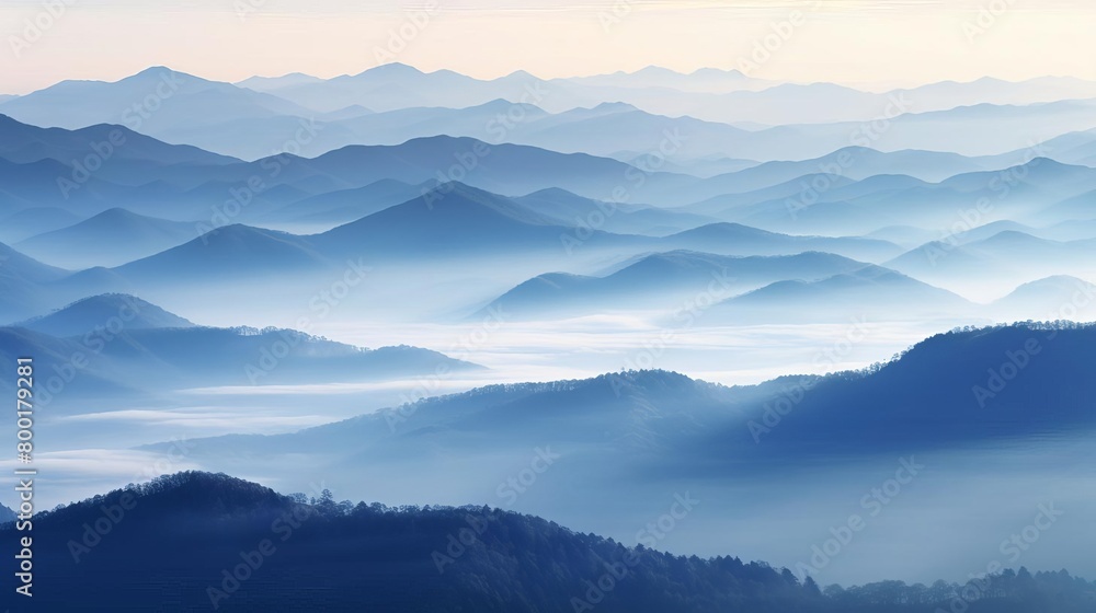 Misty mountain range at dawn, layered in hues of blue and gray for a peaceful setting Misty mountain range at dawn, layered in hues of blue and gray for a peaceful setting