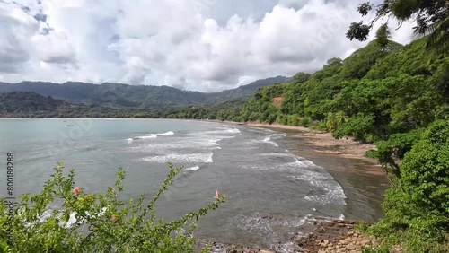 Stunning bay of Dominical. A pan over the surf beach Dominicalito. Paradise for surfers and nature lovers. photo