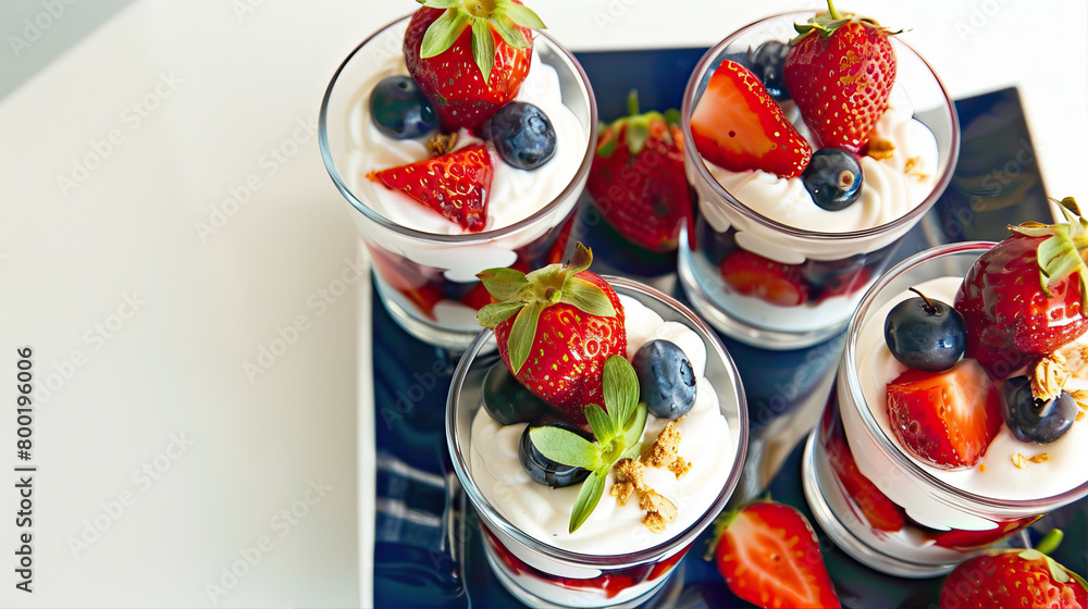 Dessert with yogurt, berries and nuts in transparent glasses
Dessert with yogurt, berries and nuts in transparent glasses
