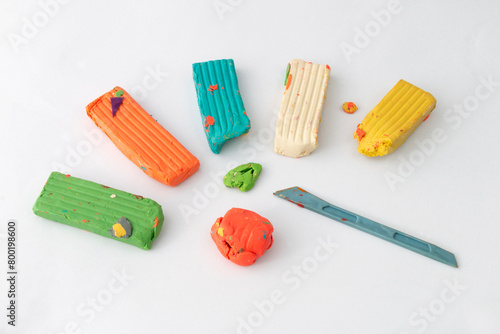 Homemade plasticine, play dough on a white background. Molding clay or slime. Homemade clay.