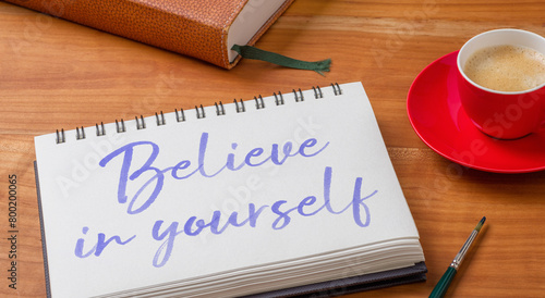  Notepad on a desk - Believe in yourself