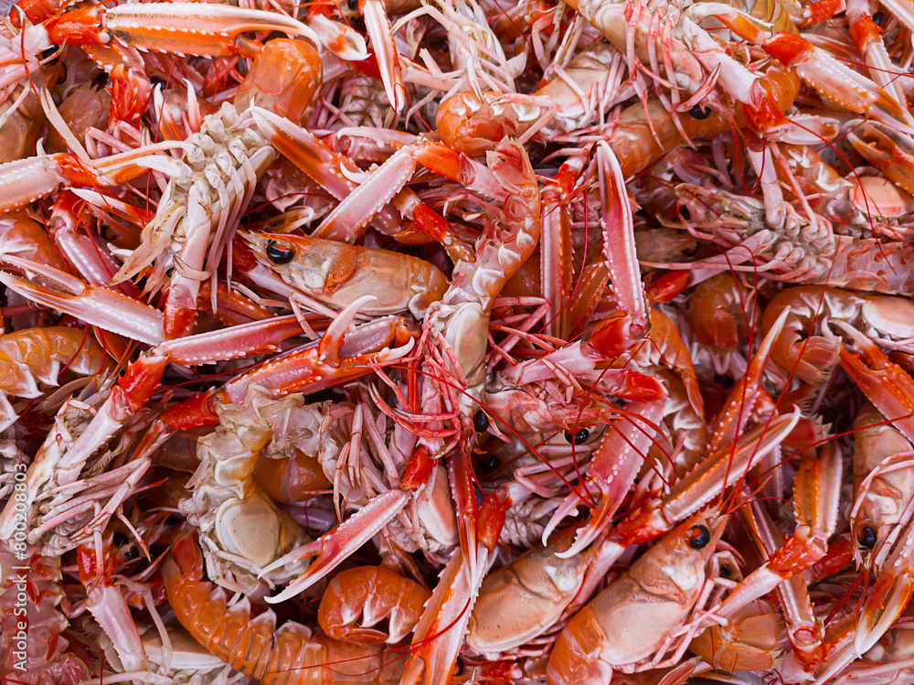 Boiled sea langoustine at a seafood market, close-up Boiled sea langoustine at a seafood market, close-up