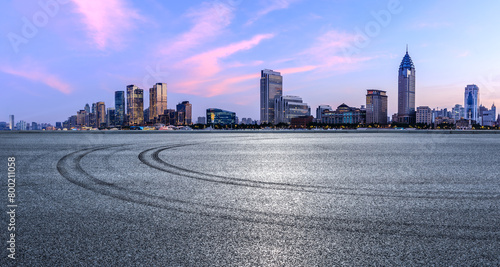 Fototapeta Naklejka Na Ścianę i Meble -  Asphalt road and city skyline with modern buildings scenery at dusk in Shanghai. Famous Bund buildings in Shanghai.