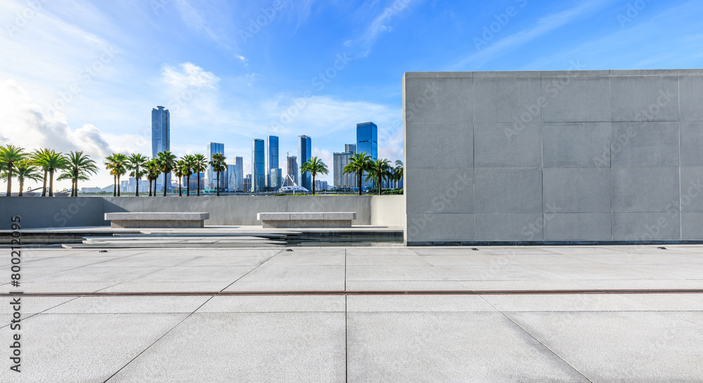 Pedestrian walkway and brick wall with modern city buildings background Pedestrian walkway and brick wall with modern city buildings background