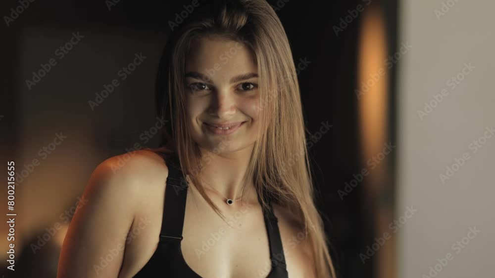 Close portrait of an attractive sporty, girl in the gym, she looks at the camera and smiles, athletic brunette, active lifestyle, lifestyle, gym, health, facial radiance, youth and strength, happy Close portrait of an attractive sporty, girl in the gym, she looks at the camera and smiles, athletic brunette, active lifestyle, lifestyle, gym, health, facial radiance, youth and strength, happy