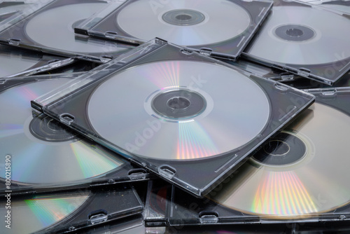 A pile of CD cases on white background