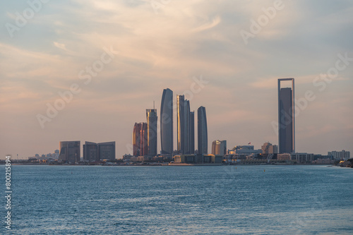 Perspective of skyscraper towers and bay cityscape skyline of Abu Dhabi  sunrise in UAE.