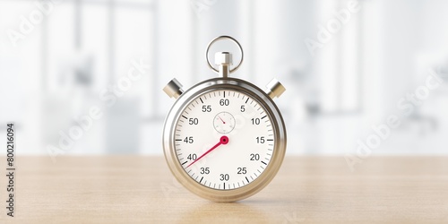 Silver classic stopwatch on blured office background