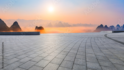 Empty square floor and beautiful mountain with sky clouds at sunrise © ABCDstock