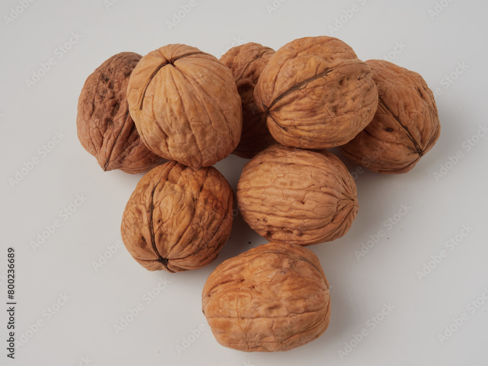 walnut and a cracked walnut isolated on the white background walnut and a cracked walnut isolated on the white background