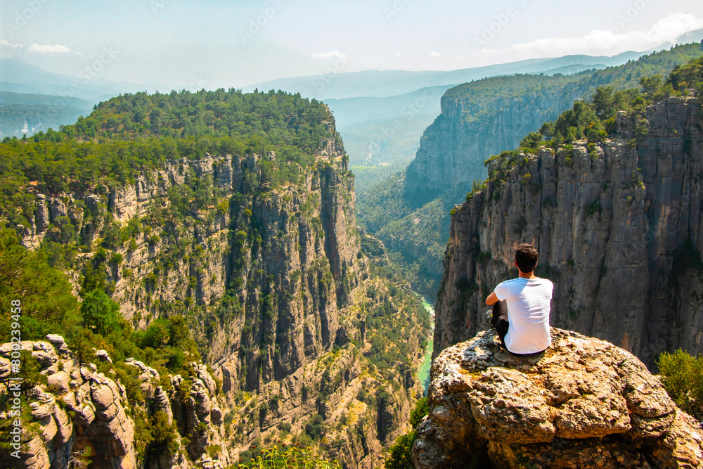 Man watching nature view. Magnificent view and majestic cliff of Tazi Canyon. View of the valley from above. Antalya, Turkey.