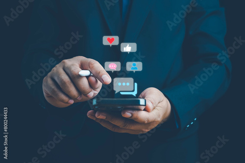 Social media and digital online concept, man using smart phone. The concept of living on vacation and playing social media. Social Distancing ,Working From Home concept. Social media concept. photo