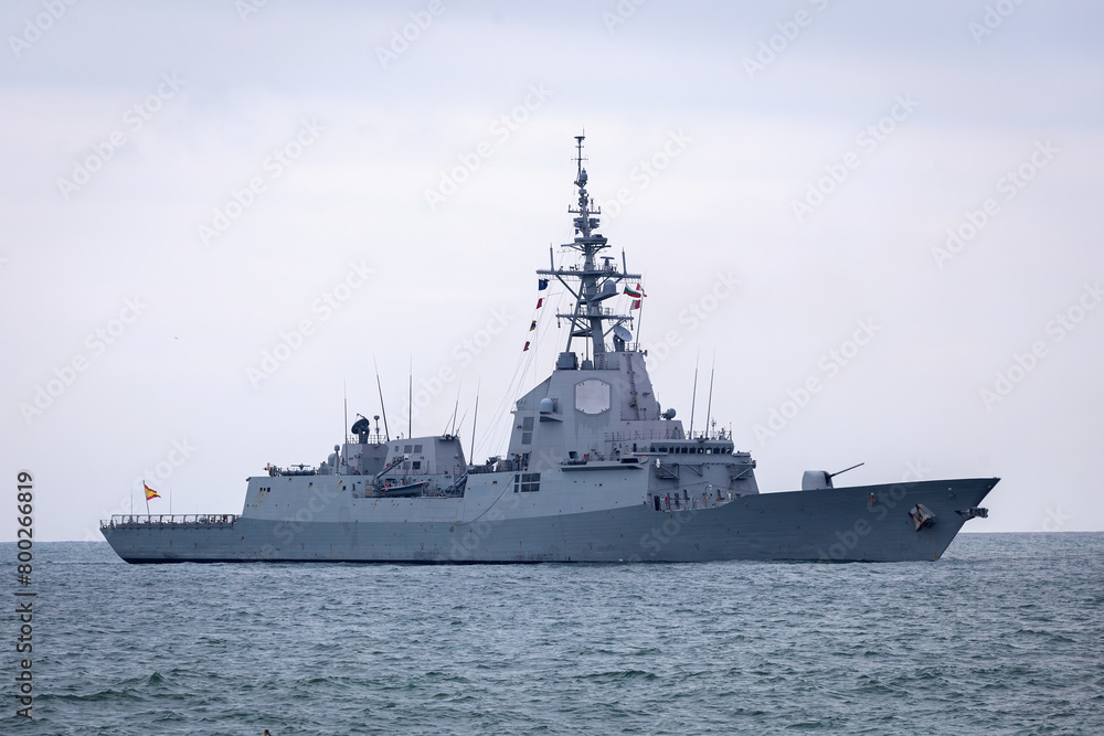 Naklejka premium Large grey modern warship sailing. NATO ship sailing at sea. Naval Forces