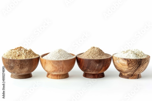 Organic flour in wooden bowls on white background