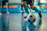 Players participating in indoor futsal matches in a sports hall Futsal training and dribbling drills in an indoor soccer league
