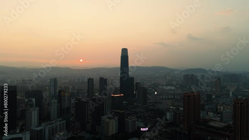 Drone shot of the Kuala Lumpur skyline at sunrise, featuring the Menara Exchange 106. photo