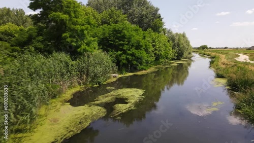 Low drone flight over stagnant stream near rural village of Batya, Hungary. photo