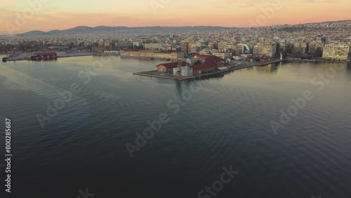 Thessaloniki Waterfront Pier at Sunset. Aristotle Square Seen From the Sky as Traffic Drives by Waterfront Buildings. Northen Greece, Ancient City. Θεσσαλονίκη, Ελλάδα photo