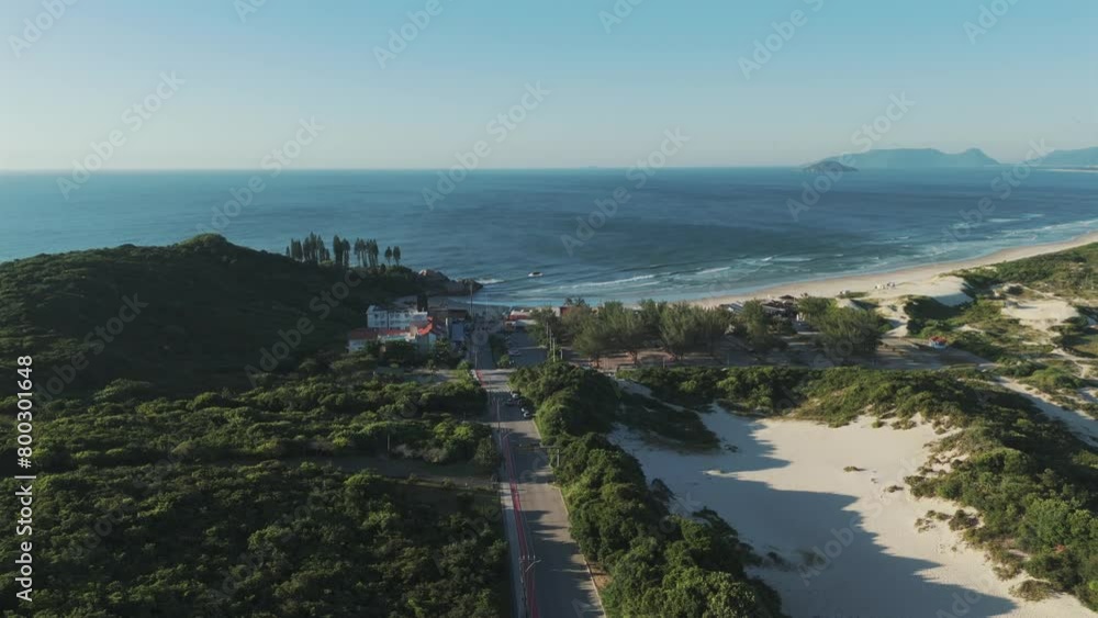 Unveiling the breathtaking Joaquina Beach on a beautiful sunny morning. Unveiling the breathtaking Joaquina Beach on a beautiful sunny morning.
