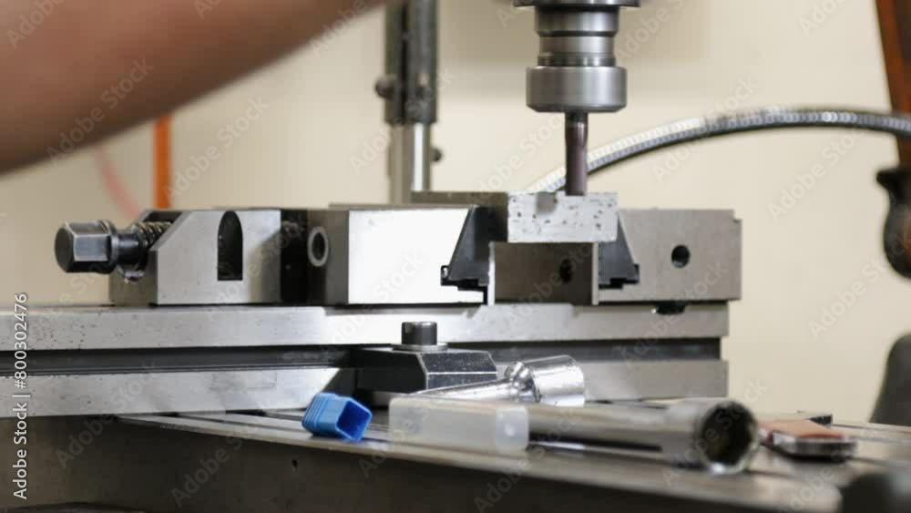 Close-up of a milling machine in operation with sharp metal parts Close-up of a milling machine in operation with sharp metal parts