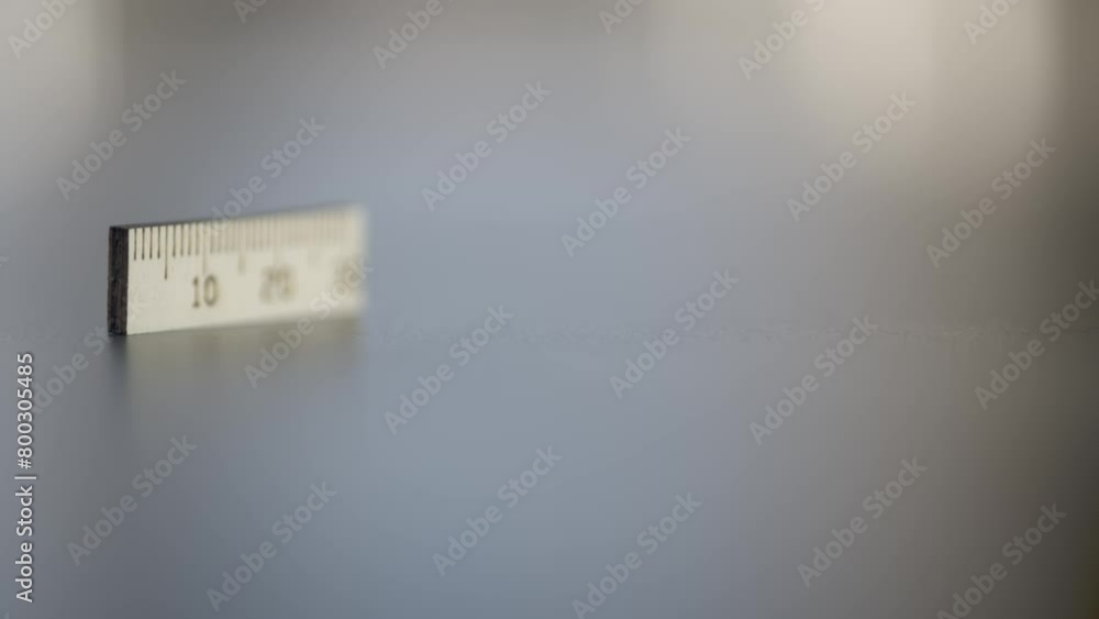 miniature ruler comes into focus dolly in miniature ruler comes into focus dolly in