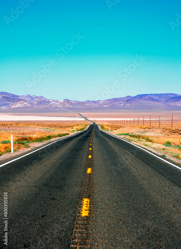 Lonely road with blue sky in Nevada, United States