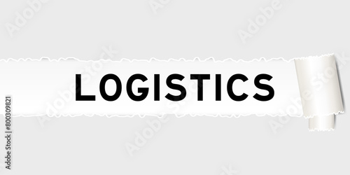 Ripped gray paper background that have word logistics under torn part