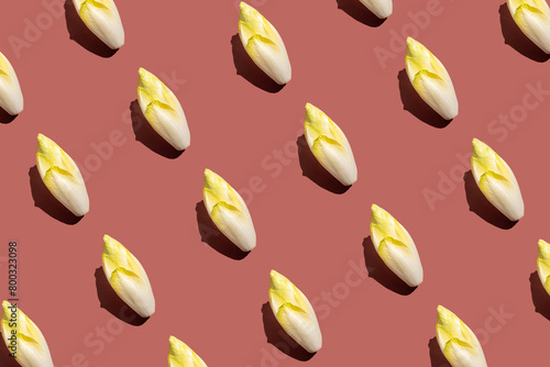 Фотография endives seamless pattern isolated on brown background