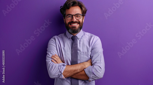 A Handsome businessman with beard wearing casual tie and glasses over purple background happy face smiling with crossed arms looking at the camera, Positive person © GraphixOne