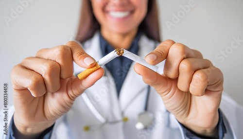 Extreme close-up of a female smiling doctor breaking a cigarette. Stop smoking, prevention, anti smoking campaign and world no tobacco day concept. Generative Ai. photo