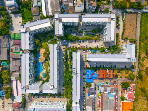 Aerial View condominium swimming pool residential complex among low-rise buildings