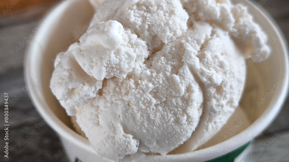 Vanilla ice cream in a paper cup Vanilla ice cream in a paper cup