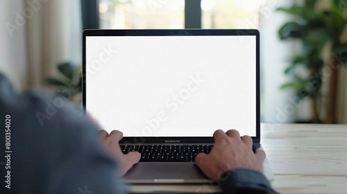 Business person working online or learning using laptop mock up blank white empty screen, hands typing on computer background close up view. Mockup display for ads. Close up view. photo