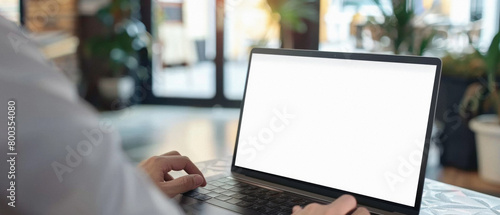 Business person working online or learning using laptop mock up blank white empty screen, hands typing on computer background close up view. Mockup display for ads. Close up view.