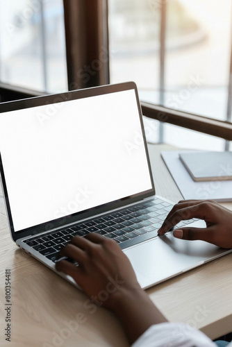 Business person working online or learning using laptop mock up blank white empty screen, hands typing on computer background close up view. Mockup display for ads. Close up view. photo