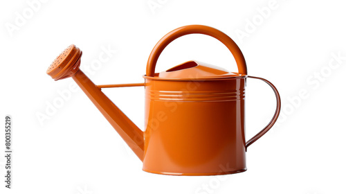 A bright orange watering can with a plastic handle resting on a table on transparent background photo