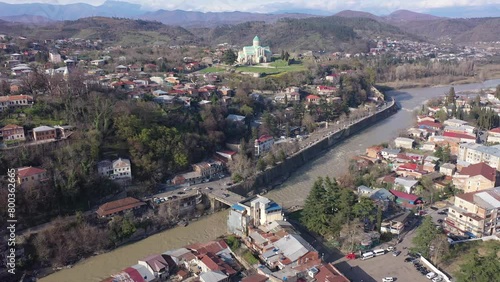 View from drone of historical districts of old Georgian city of Kutaisi on both sides of Rioni river with rebuilt building of Cathedral photo